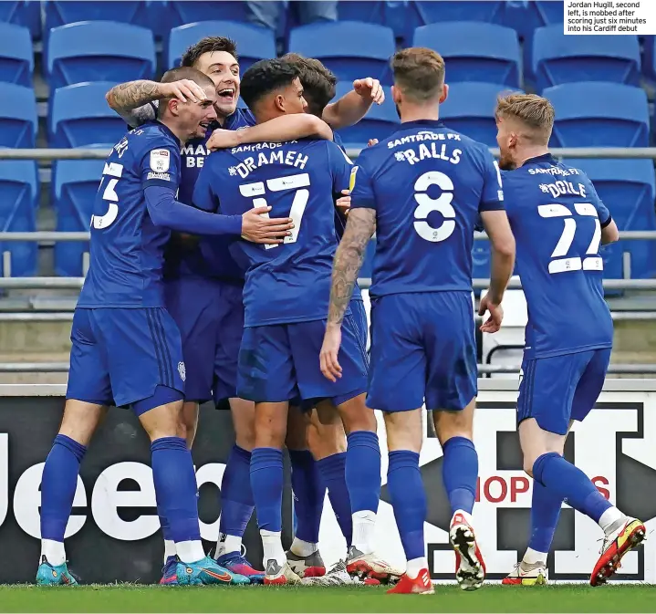  ?? ?? Jordan Hugill, second left, is mobbed after scoring just six minutes into his Cardiff debut