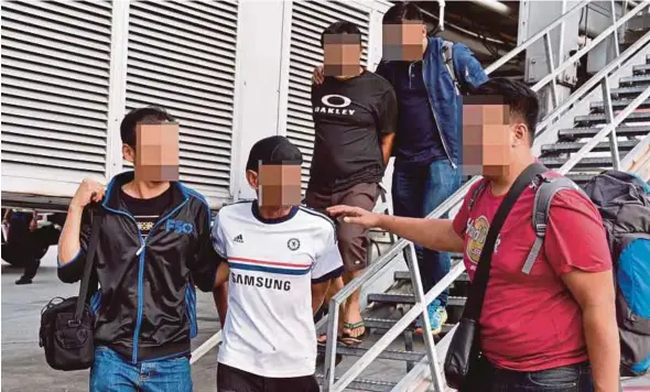  ?? PIX COURTESY OF ROYAL MALAYSIA POLICE ?? Some of the eight suspected terrorists who were arrested in operations in three states.