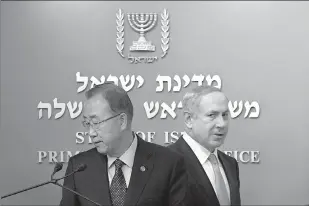  ?? Associated Press ?? United Nations Secretary-General Ban Ki-moon, left, and Israeli Prime Minister Benjamin Netanyahu, arrive to a news conference Tuesday at the Prime Minister’s office in Jerusalem. Netanyahu says Palestinia­n President Mahmoud Abbas is “fanning the...