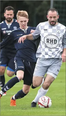  ??  ?? Manny Smith of Boyne Harps comes under pressure from Ardee Celtic’s Bryan O’Connor during Friday’s game in Townparks.