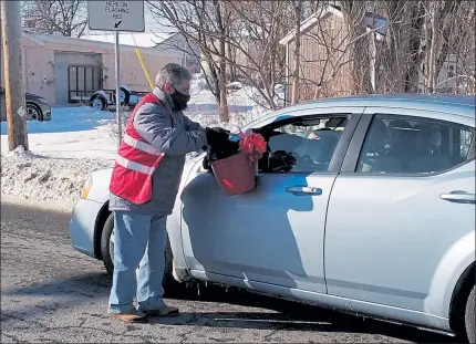  ?? DANIELLE RAY / SENTINEL & ENTERPRISE ?? Fitchburg Mayor Steve DiNatale collected for the Salvation Army’s boot drive on John Fitch Highway last weekend.