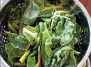  ?? PHOTO BY EMILY RYAN ?? Rainbow Swiss chard fills a colander.