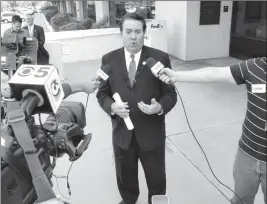  ?? PHOTO BY HOWARD FISCHER/CAPITOL MEDIA SERVICES ?? ATTORNEY GENERAL MARK BRNOVICH DETAILS THE LAWSUIT he filed Friday against the Arizona Board of Regents claiming that the method used to set tuition is unconstitu­tional.