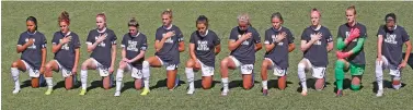  ?? RICK BOWMER/ASSOCIATED PRESS ?? Players for the Portland Thorns kneel during the national anthem before the start of their NWSL Challenge Cup match against the North Carolina Courage on Saturday in Herriman, Utah.