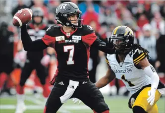  ?? JUSTIN TANG THE CANADIAN PRESS ?? Trevor Harris was a strike force in Sunday’s Eastern final win, firing a playoff record six TDs on 29-of-32 passing and 367 yards. He also spread the ball to 10 receivers en route to Ottawa’s return to the Grey Cup.