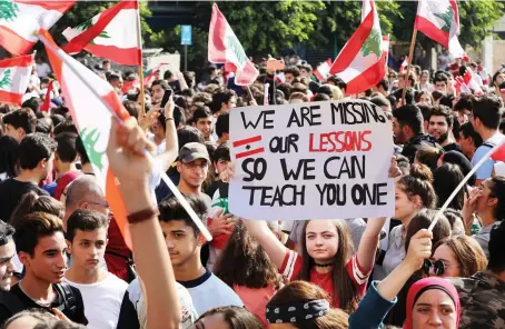  ?? AFP ?? Lebanese students from various schools take part in a protest in front of the Ministry of Education in Beirut. Students took to the streets to demand a better future.