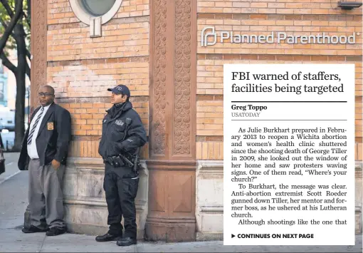  ?? ANDREW BURTON, GETTY IMAGES ?? A police officer stands guard outside Planned Parenthood on Monday in New York City.