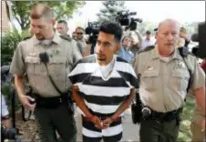  ?? CHARLIE NEIBERGALL — THE ASSOCIATED PRESS ?? Cristhian Bahena Rivera is escorted into the Poweshiek County Courthouse for his initial court appearance, Wednesday in Montezuma, Iowa. Rivera is charged with first-degree murder in the death of Mollie Tibbetts, who disappeare­d July 18 from Brooklyn, Iowa.