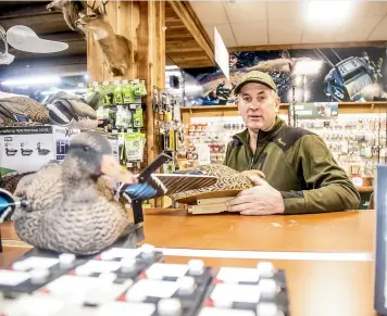  ?? KAVINDA HERATH/STUFF ?? Hunting & Fishing Invercargi­ll manager Gerald McRae says customers seemed to be more excited than ever, with the odd person from Australia and hunters from the North Island travelling down to kick off the start of the duck shooting season with mates on Saturday.