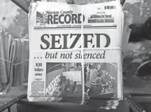  ?? JOHN HANNA/AP ?? Forced to rewrite stories and reproduce ads from scratch, the four-person newsroom of the Marion County Record in Marion, Kan., worked overnight to print Wednesday’s edition.