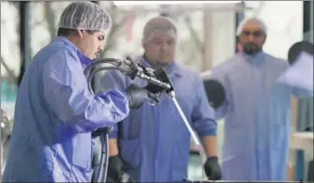  ?? PROVIDED TO CHINA DAILY ?? Technician­s at work at Leyard’s plant at Hillsboro, Oregon, US.