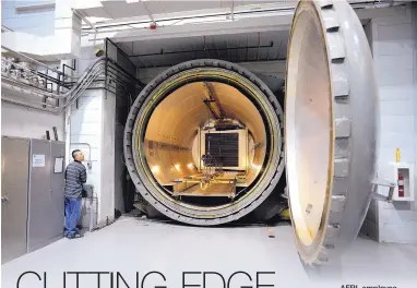  ??  ?? AFRL employee Jeff Brumfield shows a massive autoclave at the lab’s Integrated Structural Systems lab.