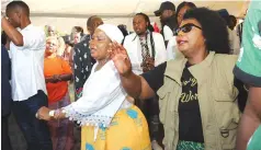  ?? ?? First Lady Dr Auxillia Mnangagwa and actress Patience Musa, popularly known as Mai Jilimbi, join the crowd in singing gospel songs during the funeral wake for actress Stella January in Mufakose
