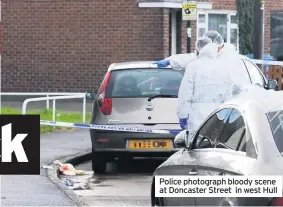  ??  ?? Police photograph bloody scene at Doncaster Street in west Hull