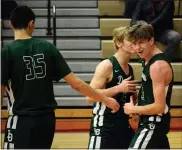  ?? MEDIANEWS GROUP FILE PHOTO ?? Lake Orion’s Brennan Jones, right, scored a game-high 15 points while teammate Andrew Bryant, middle, nailed a 3-pointer at the buzzer, leading the Dragons to a win over Berkley Tuesday. Lake Orion is 7-2, 4-1in the OAA Blue.