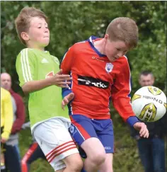  ??  ?? Rian Ormonde of Curracloe United wins this tussle for possession with Legia’s Kamil Walkosz.