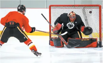  ?? CP PHOTO ?? Calgary Flames goalie Mike Smith spends some time in the net on Wednesday in Calgary prior to the start of training camp.