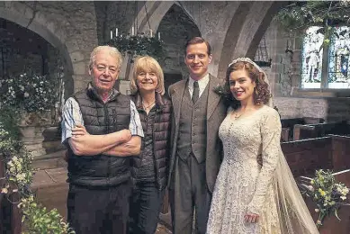  ?? ?? CONNECTION: Alf Wight’s children Rosie Page and Jim Wight visited Nicholas Ralph and Rachel Shenton during the filming of the wedding scene in series three.