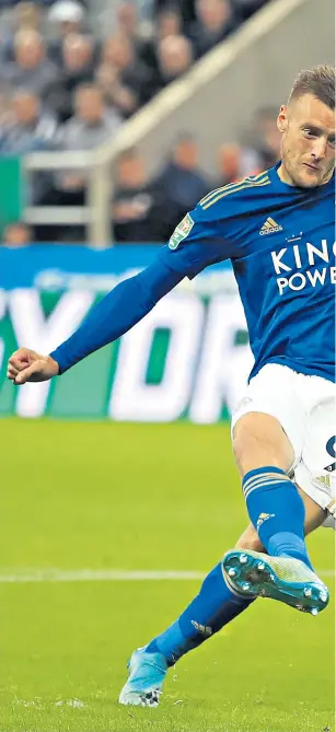  ??  ?? Decisive penalty: Jamie Vardy scores for Leicester in their shoot-out victory