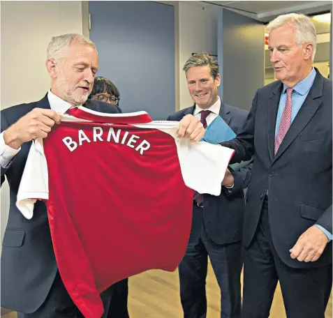  ??  ?? Jeremy Corbyn, with Diane Abbott and Sir Keir Starmer in attendance, presents Michel Barnier with an Arsenal shirt at their previous meeting in Brussels last July