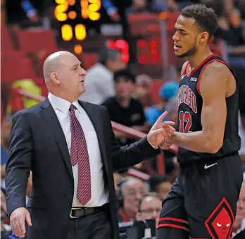  ?? LYNNE SLADKY/AP ?? Jim Boylen (with forward Daniel Gafford) was an assistant under the Bulls’ previous coach, Fred Hoiberg, then was promoted when Hoiberg was fired in December 2018. Boylen had a .317 winning percentage.