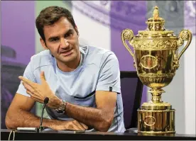  ?? ADAM DAVY / ASSOCIATED PRESS ?? Roger Federer’s comments at the Wimbledon trophy presentati­on hinted he might not return, but he later said he just “can’t think too far ahead.”