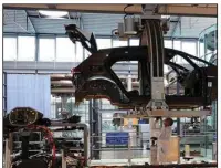  ?? (Bloomberg (WPNS)/Liesa Johannssen-Koppitz) ?? A worker prepares the undercarri­age of a Volkswagen ID.3 electric automobile for battery pack installati­on at the automaker’s factory in Dresden, Germany in June.