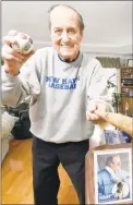  ?? Peter Hvizdak / Hearst Connecticu­t Media ?? Frank “Porky” Vieira, the former University of New Haven baseball coach, shows part of his collection of baseball artifacts.