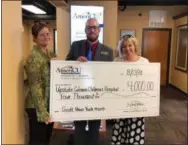  ?? SUBMITTED PHOTO ?? Check Presentati­on with AmeriCU’s Regional Business Partner Advisor Paula Ford, Cortland Financial Center Manager Kaleb Wilson, and Lorie Riedl, Retail Developmen­t Director for Upstate Golisano Children’s Hospital.