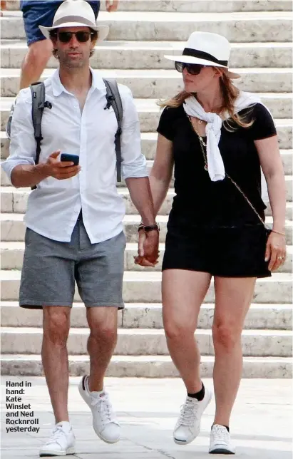 ??  ?? Hand in hand: Kate Winslet and Ned Rocknroll yesterday