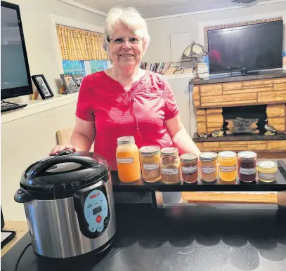  ?? CONTRIBUTE­D ?? Darlene Ramsay of Springhill, P.E.I., uses her pressure canner to safely preserve everything from vegetables to meat, seafood and poultry. Ramsay is one of many people who are finding ways to save money and stretch their food dollars, especially important in these days of rising prices not only at the grocery store but at the gas pump as well.