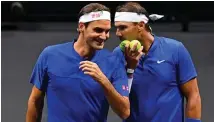  ?? AFP PHOTO ?? Switzerlan­d’s Roger Federer (left) gets instructio­ns from Spain’s Rafael Nadal of Team Europe playing against USA’s Jack Sock and USA’s Frances Tiafoe of Team World during their 2022 Laver Cup men’s doubles tennis match at the O2 Arena in London on Friday, Sept. 23, 2022 (September 24 in Manila).