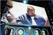  ?? USA Today Sports - Kirby Lee ?? Georgia defensive end Travon Walker, who did not attend the draft, reacts after being selected as the first overall pick by the Jaguars.