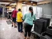  ?? THE NEW YORK TIMES ?? As families pass through the airport, scientists want them to be aware of recent findings. Scientists found the viruses responsibl­e for colds and influenza on the trays used at checkpoint­s.