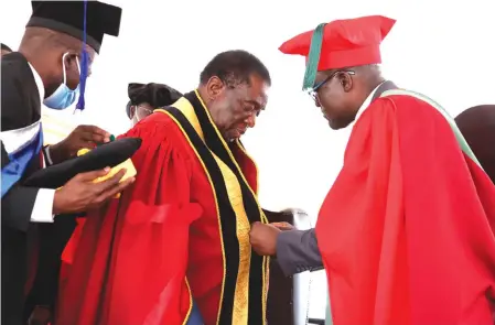  ?? — Picture: Tawanda Mudimu ?? President Mnangagwa (left) is installed Manicaland State University of Applied Sciences Chancellor by Professor Albert Chawanda at the institutio­n’s maiden graduation ceremony in Mutare yesterday. Prof Chawanda was also installed Vice Chancellor of the university.