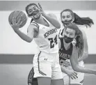  ?? DAVE KALLMANN / MILWAUKEE JOURNAL SENTINEL ?? Oak Creek's Paulina Hernandez grabs a rebound against Franklin in a Southeast Conference game Friday at Oak Creek.