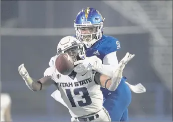  ?? TONY AVELAR — THE ASSOCIATED PRESS ?? San Jose State defensive back Bobby Brown II breaks up a pass for Utah State wide receiver Deven Thompkins (13) during a game on Nov. 13.