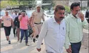  ?? SANT ARORA/ HT ?? The accused in ‘cash for job’ scam being taken by the police to a court in Panchkula on Friday.