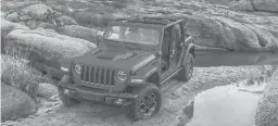  ?? STELLANTIS/TNS ?? Few trails are too rough for the 2021 Jeep Wrangler Rubicon 4xe.