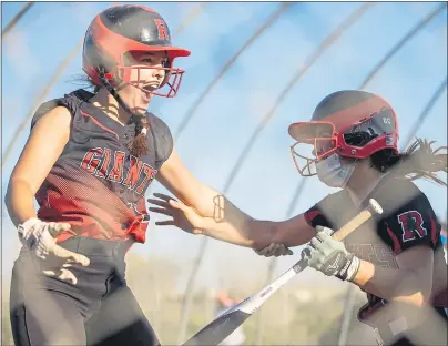  ?? PHOTOS BY ETHAN SWOPE — SPECIAL TO THE MARIN INDEPENDEN­T JOURNAL ?? Morgan Bello celebrates after scoring the winning run for Redwood during its softball game against visiting San Rafael on Wednesday.