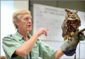  ?? Submitted photo ?? BOGART REHAB: Rodney Paul, owner and director of the Raptor Rehab of Central Arkansas, displayed Bogart the great horned owl Friday during National Park College’s First Friday Lecture Series in the Laboratory Science Building. Paul and volunteer Tina...