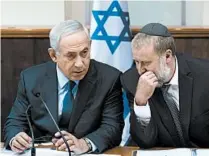  ?? ABIR SULTAN/EPA 2015 ?? Israel’s Benjamin Netanyahu, left, speaks with Avichai Mandelblit. He recommende­d charges against Netanyahu.