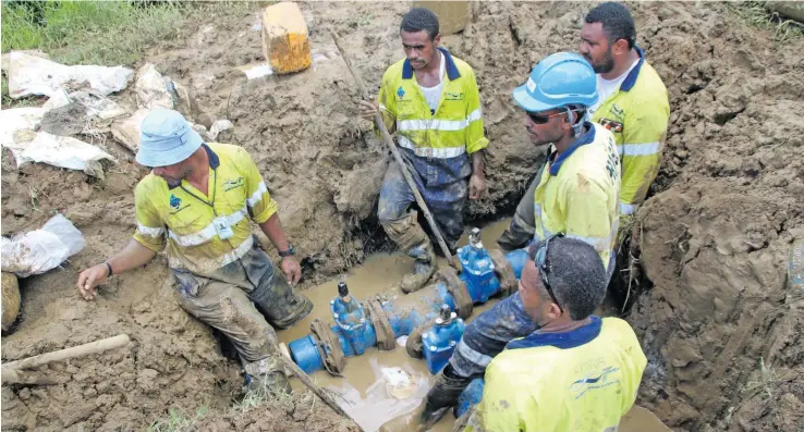  ?? Photo: WAF ?? Water Authority of Fiji (WAF) crew members conduct installati­on works at the injection point at Suvalailai to boost water supply to the Burebasaga area.