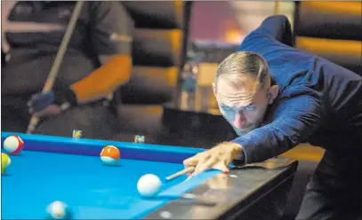  ?? Patrick Connolly ?? Las Vegas Review-journal @Pconnpie Vilmos Foldes lines up his shot Sunday during the U.S. Open 8-Ball Championsh­ip at Griff ’s Las Vegas.