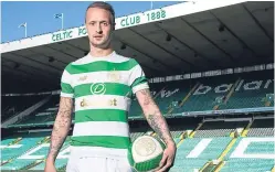  ??  ?? Leigh Griffiths models Celtic’s new kit for season 2017-18.