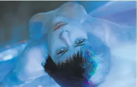  ??  ?? HIGHLY ANIMATED: Scarlett Johansson as Motoko Kusanagi in ’Ghost in the Shell ’