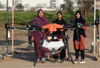  ?? ?? Bharti (centre), instructor at Drone Destinatio­n, training women aspiring to be remote pilots to operate a drone under the government-backed ‘Drone Sister’ programme in Manesar.