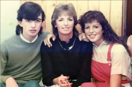  ??  ?? Grieving: Marie McCourt with son Michael and daughter Helen, four years before her murder