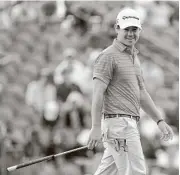  ?? Jamie Squire / Getty Images ?? Brian Harman smiles on the 18th green Saturday. Harman is 12 under par at 204 to lead by a stroke entering Sunday’s final round.