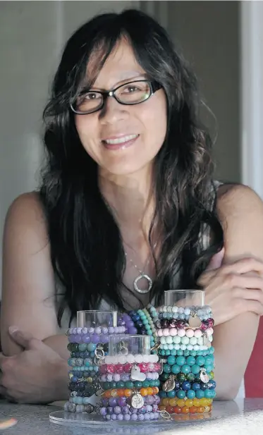  ??  ?? Sandra Paetsch of Orange Avocado makes stackable beaded bracelets in a cornucopia of colours. “People are getting to be totally bold with their jewelry,” Paetsch says.